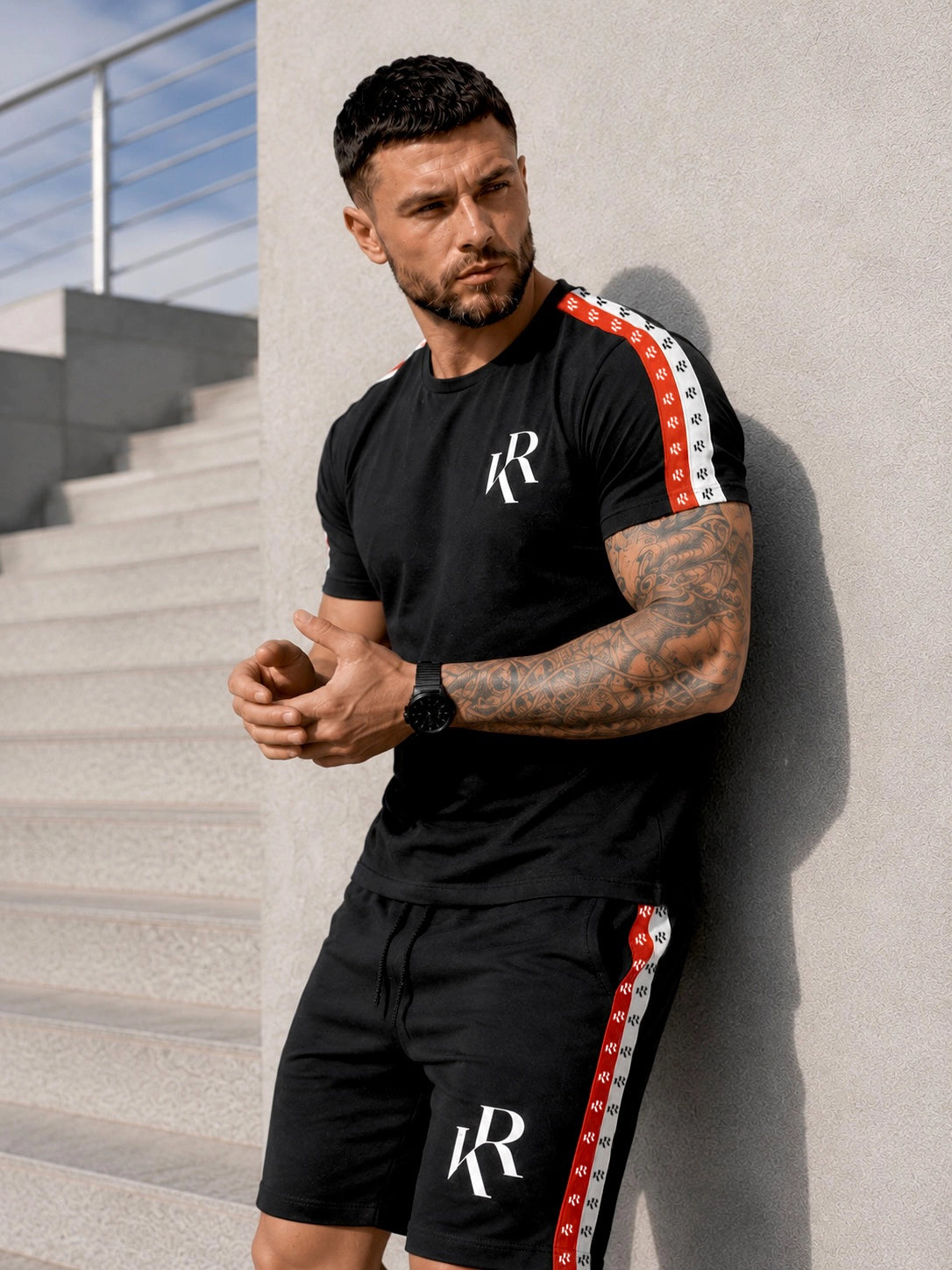 Men’s black two piece summer set NIZZA by KRUTYAKOV with cotton t-shirt, matching shorts and bold red and white side stripe details