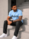 KRUTYAKOV men’s light blue graphic tee styled with black pants for a clean urban casual outfit