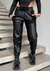 Handmade black faux leather joggers for women with suede texture details and comfortable relaxed fit