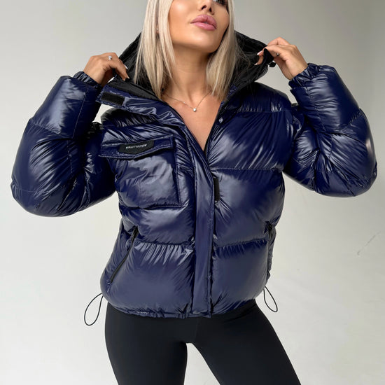Blue insulated puffer jacket for women with glossy nylon shell and hood