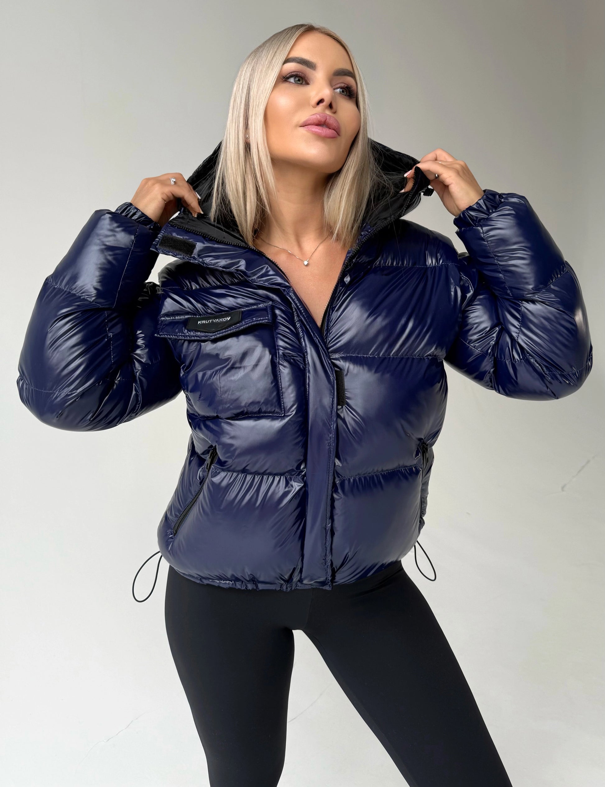 Blue insulated puffer jacket for women with glossy nylon shell and hood