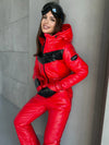 Close fashion view of KRUTYAKOV SANTA red ski suit showing glossy fabric and tailored women’s fit