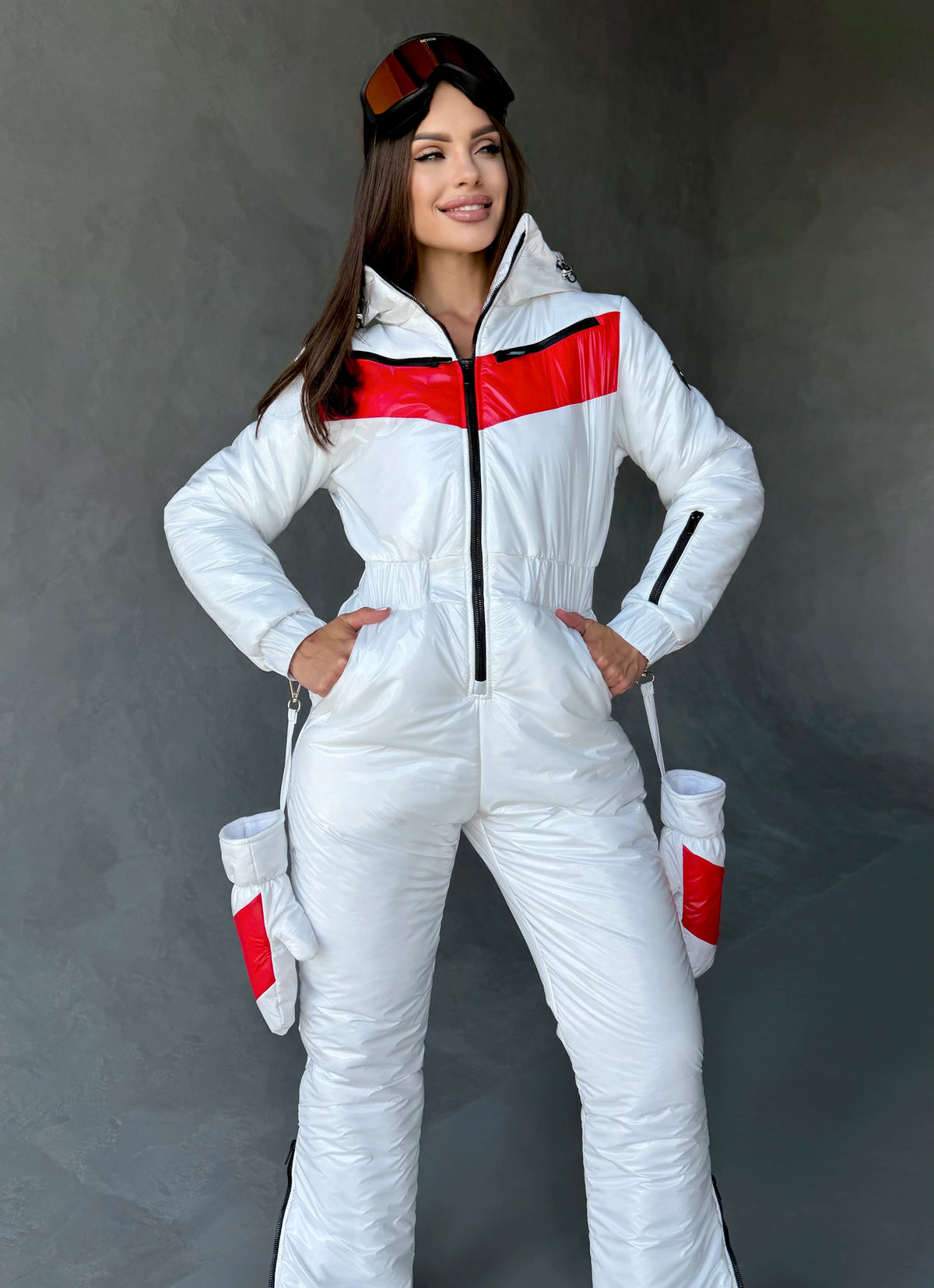Full-length white ski jumpsuit for women with red contrast details