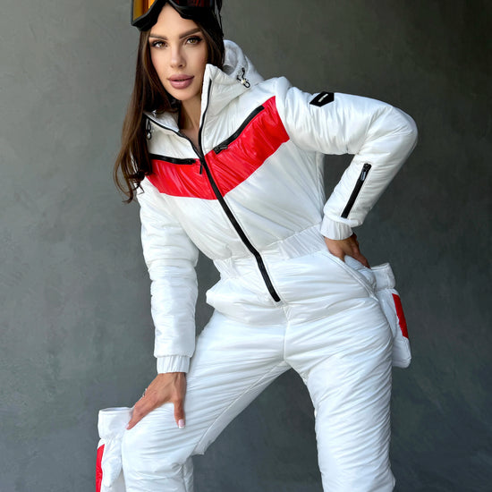 Women’s glossy white winter ski suit with red chest panels and black zippers