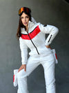 Women’s glossy white winter ski suit with red chest panels and black zippers