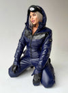 Close-up style view of SANTA dark blue ski jumpsuit showing glossy fabric, zipper details, and warm winter construction