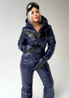 Full-body dark blue ski jumpsuit for women with hood, matching gloves, and sleek winter silhouette