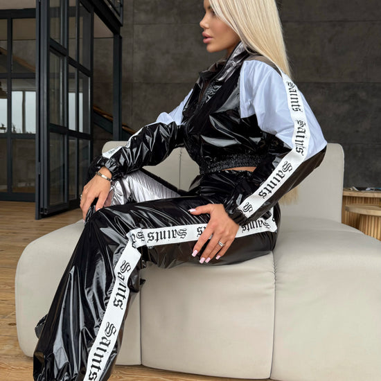 KRUTYAKOV women’s glossy black tracksuit with white and silver details