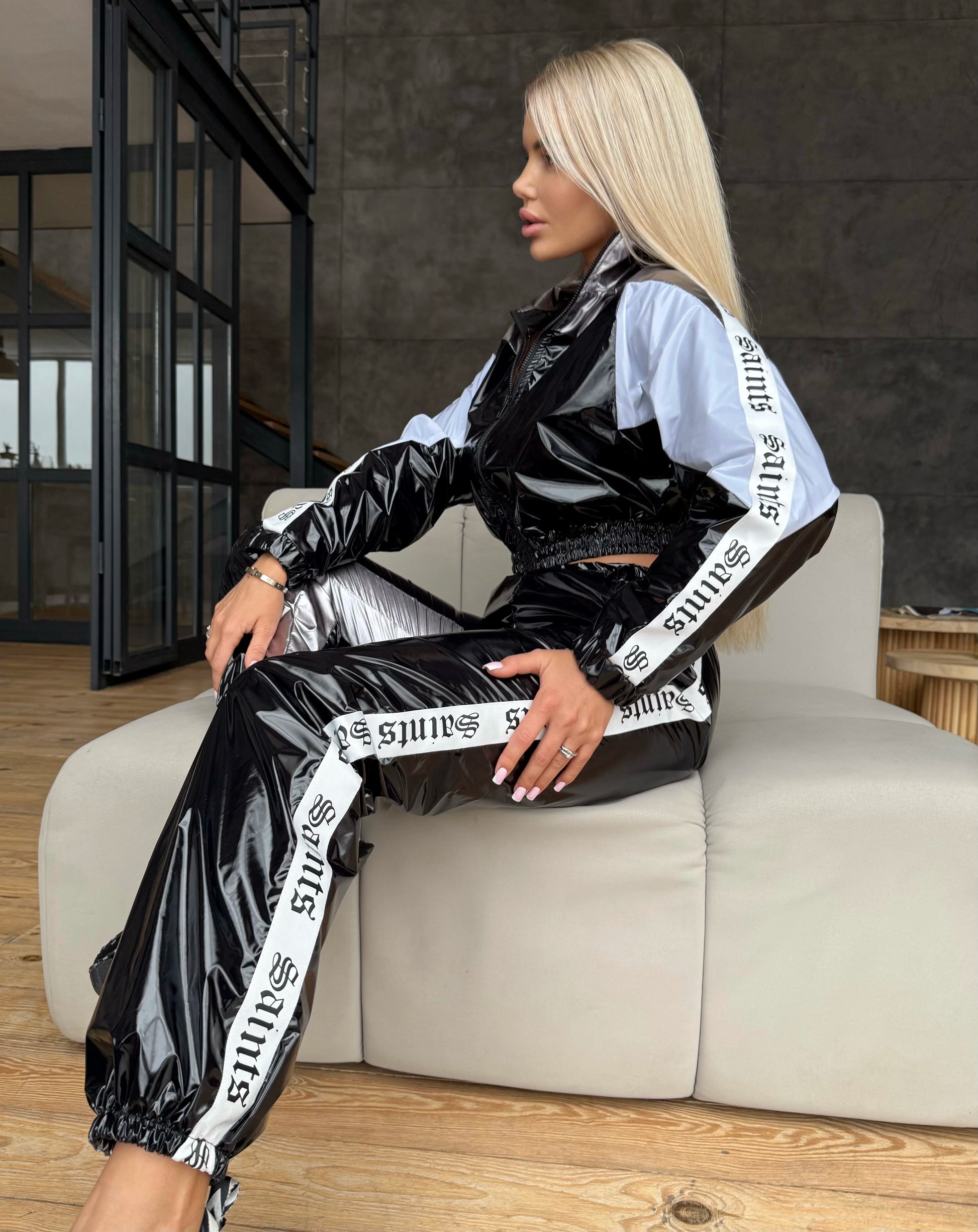 KRUTYAKOV women’s glossy black tracksuit with white and silver details