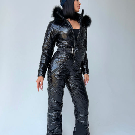 Women’s black glossy winter ski jumpsuit with fur-trimmed hood