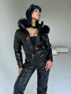 Side view of women’s black glossy insulated ski suit by KRUTYAKOV