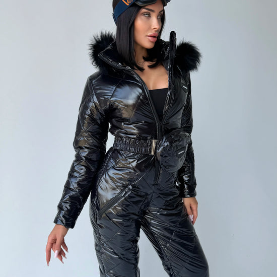 Designer black glossy one piece snow suit for women by KRUTYAKOV