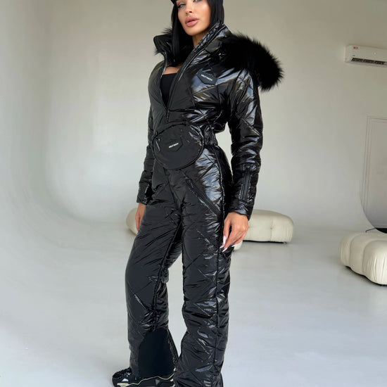 KRUTYAKOV women’s black glossy ski suit with zippered front and fur hood