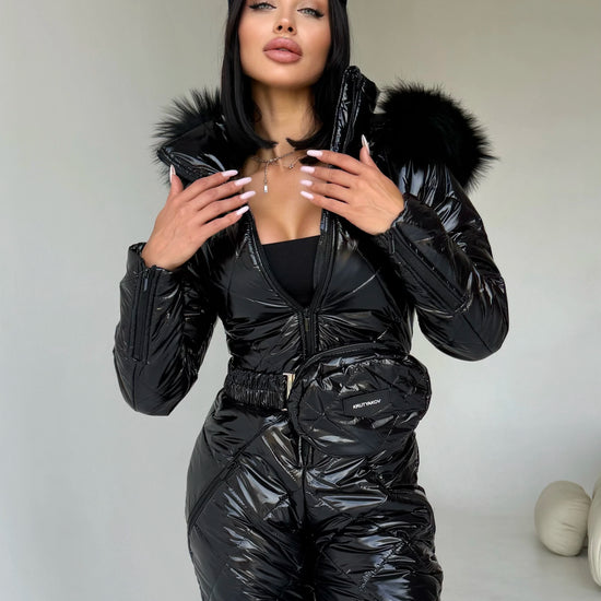 Women’s black glossy ski suit with detachable fur-trimmed hood