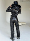 Back view of KRUTYAKOV women’s black glossy ski jumpsuit