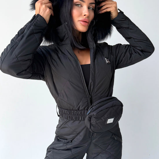 Black matte women’s ski jumpsuit with fur-trimmed hood by KRUTYAKOV