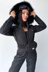 Black matte women’s ski jumpsuit with fur-trimmed hood by KRUTYAKOV