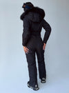 Back view of women’s black matte insulated one piece ski suit