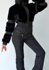Black winter jumpsuit detail with fitted waist and insulated pants