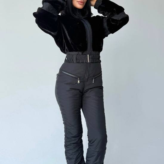 Women’s black one-piece snowsuit with eco fur and elegant winter silhouette