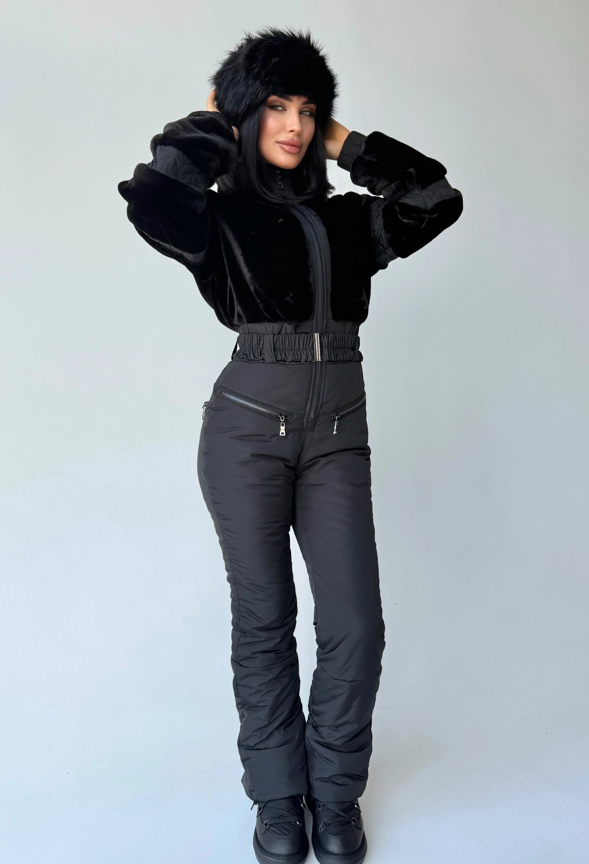 Women’s black one-piece snowsuit with eco fur and elegant winter silhouette