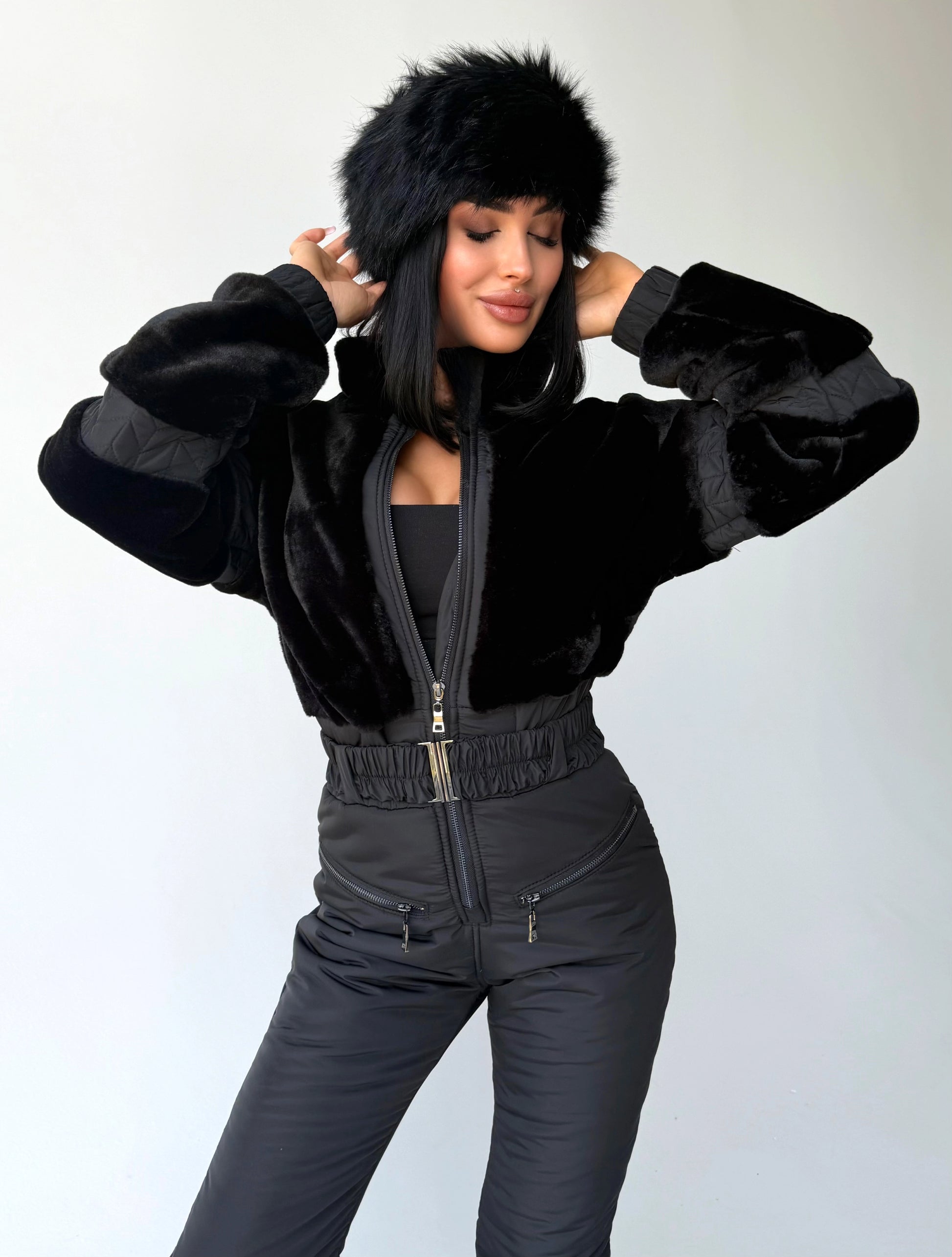 Women’s black winter jumpsuit close-up with Black Rabbit eco fur trim