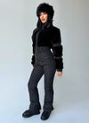 Women’s black winter jumpsuit full-body view with matching mittens