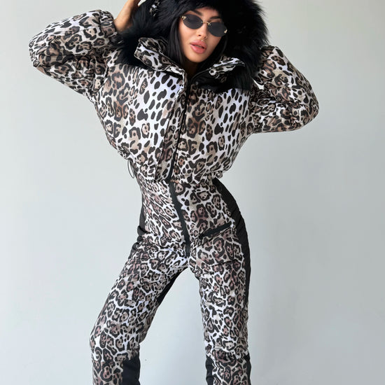 Women’s leopard winter ski suit with black fur hood and fitted silhouette