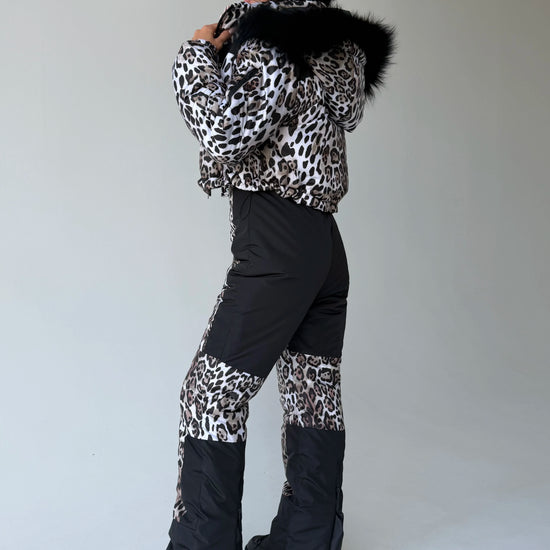 Rear view of women’s leopard two-piece snowsuit by KRUTYAKOV