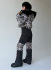Rear view of women’s leopard two-piece snowsuit by KRUTYAKOV