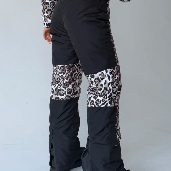 Leopard ski bib pants with black lower leg panels for women