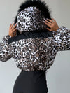 Back detail of NAIROBI leopard winter jacket with black fur hood