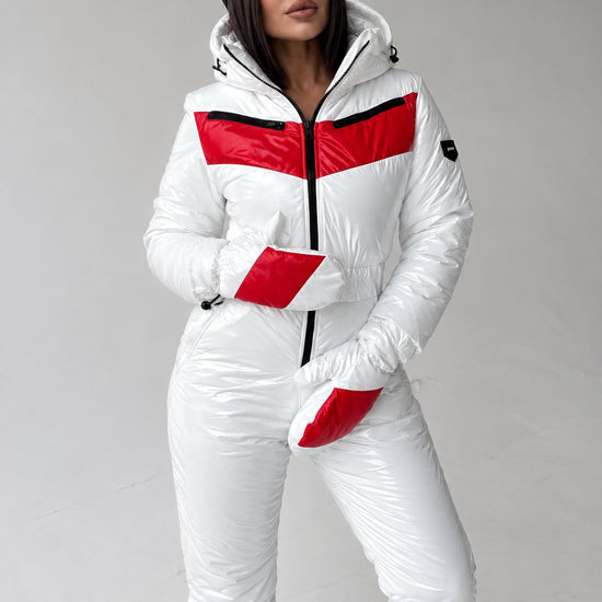 Front view of white glossy women’s ski jumpsuit with red accents
