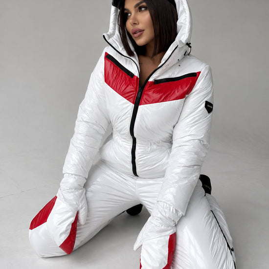 Women’s white one-piece ski suit with red panels and matching mittens