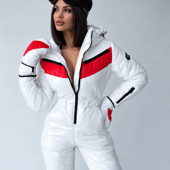 Women’s white ski suit SANTA with fitted waist and black ski goggles