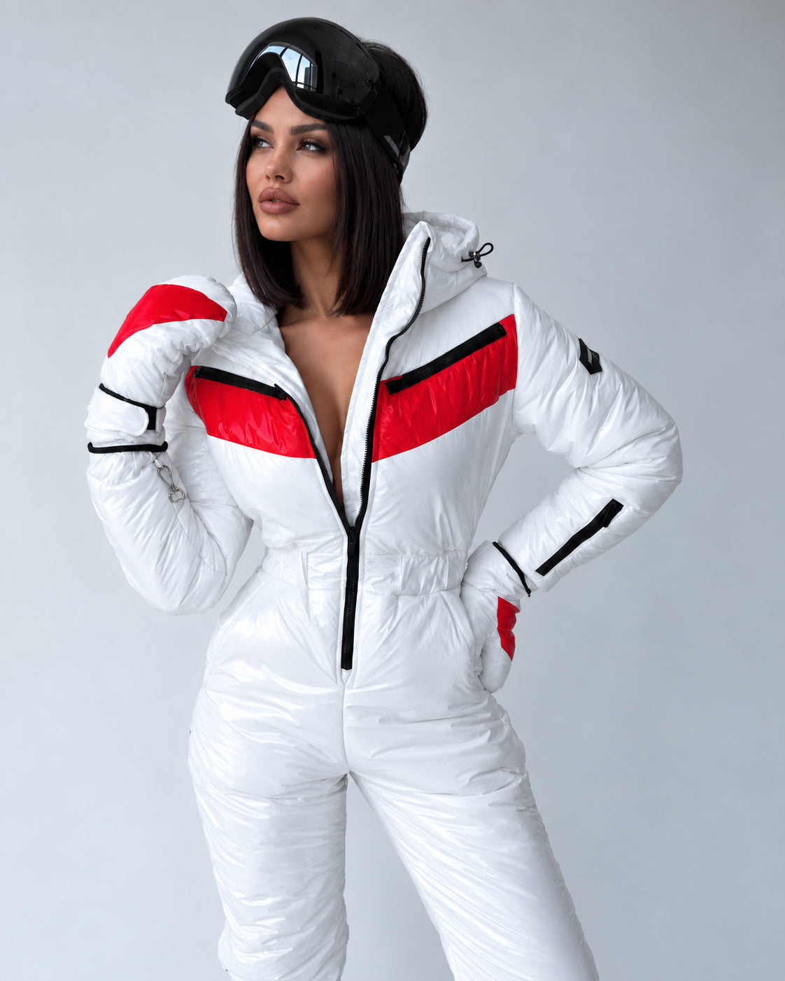 Women’s white ski suit SANTA with fitted waist and black ski goggles