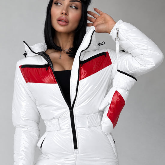 Close-up of women’s white and red ski jumpsuit with hood by KRUTYAKOV