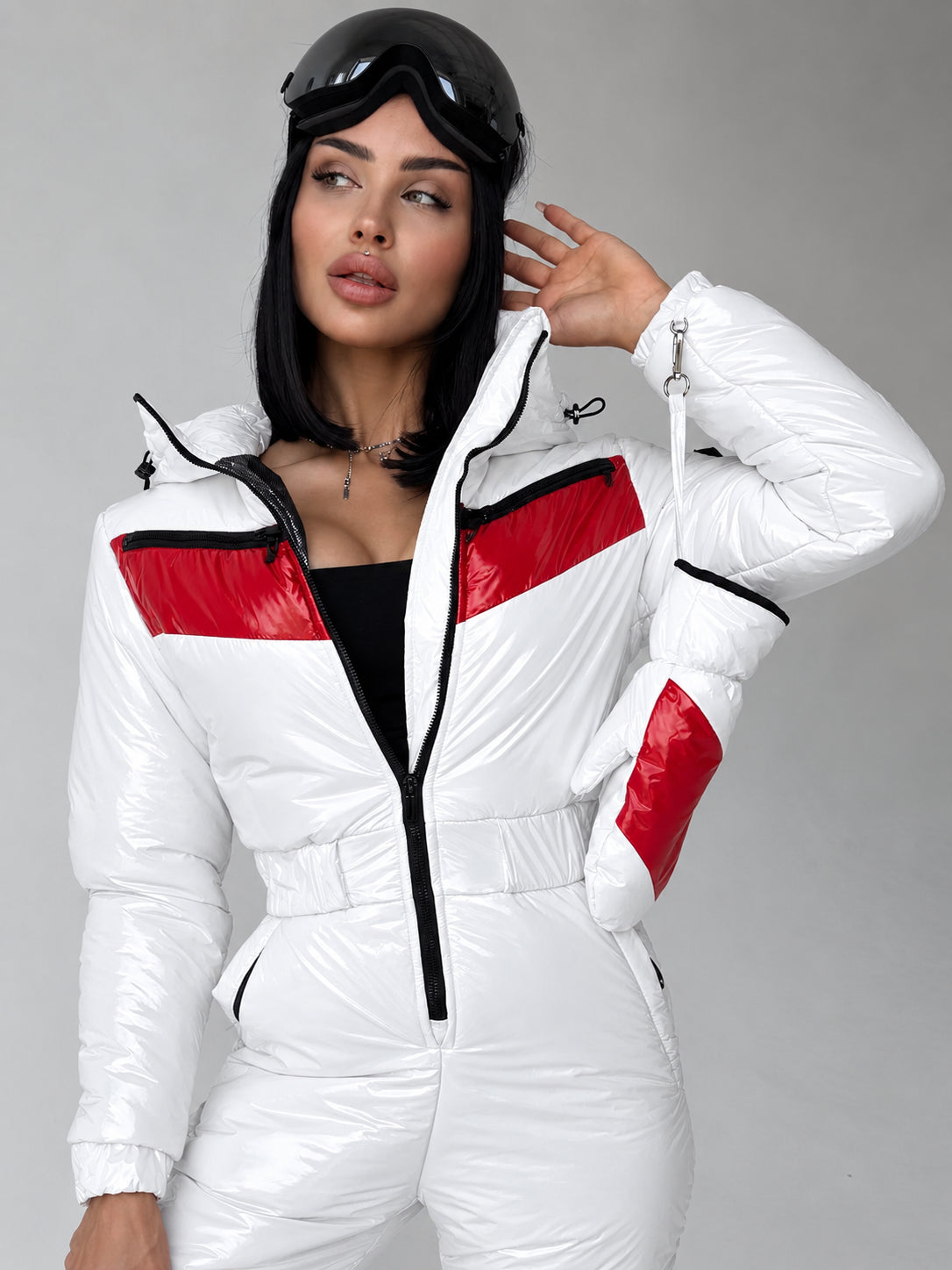 Close-up of women’s white and red ski jumpsuit with hood by KRUTYAKOV