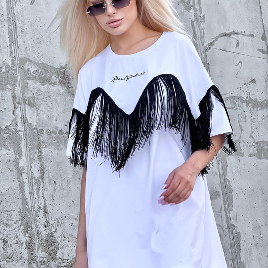 Side view of KRUTYAKOV oversized white T-shirt showing long fringe detail and loose comfortable shape