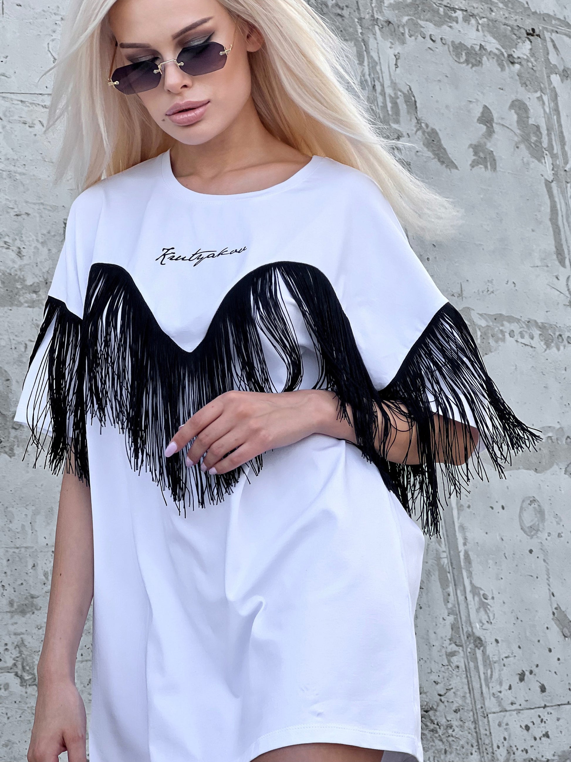 Back view of Ankora white designer T-shirt highlighting the clean oversized cut and minimalist streetwear look