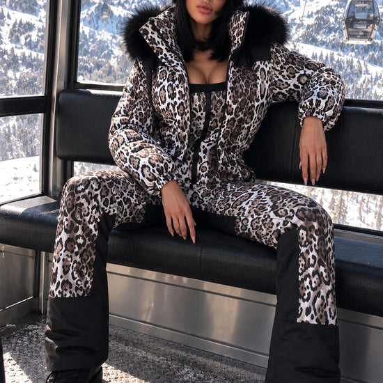 Women’s leopard two-piece ski suit NAIROBI by KRUTYAKOV at an alpine resort