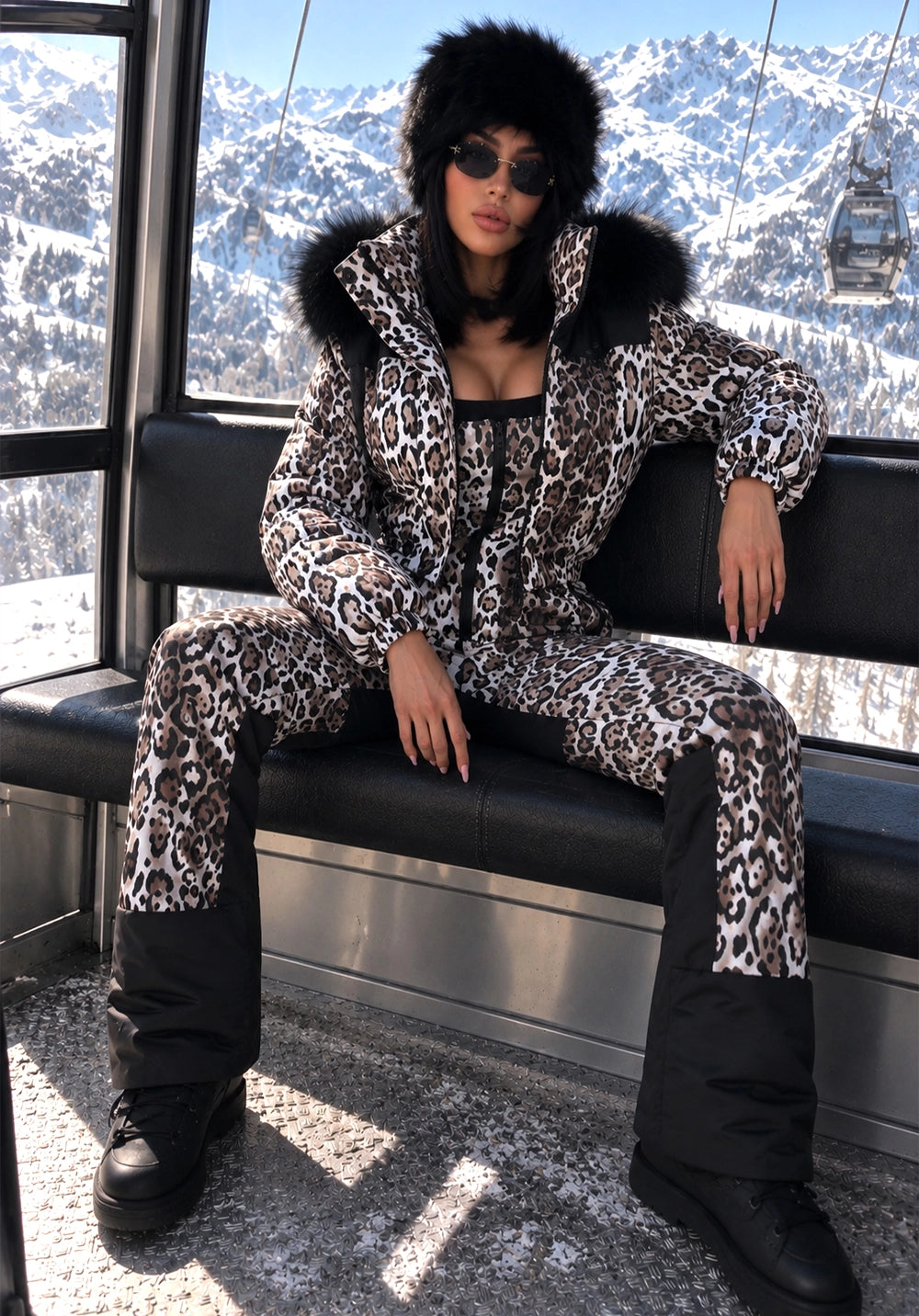 Women’s leopard two-piece ski suit NAIROBI by KRUTYAKOV at an alpine resort