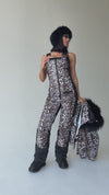 Women wearing KRUTYAKOV NAIROBI leopard two-piece ski suit