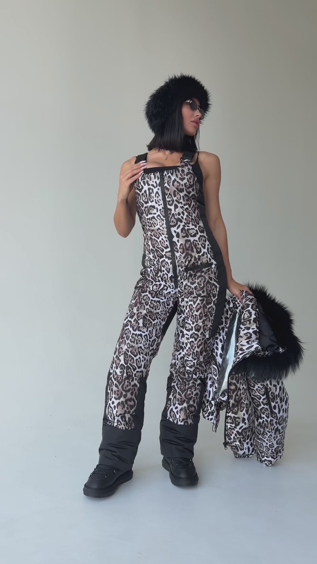 Women wearing KRUTYAKOV NAIROBI leopard two-piece ski suit