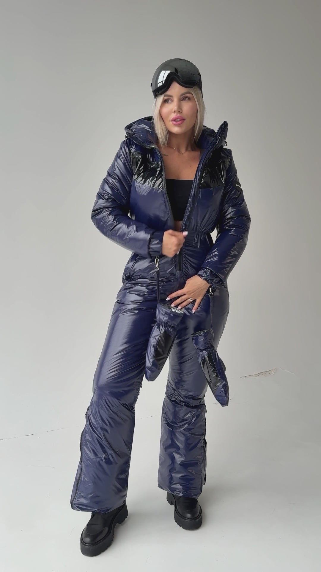 KRUTYAKOV SANTA women’s snow suit styled with skis for skiing, snowboarding, and mountain resorts