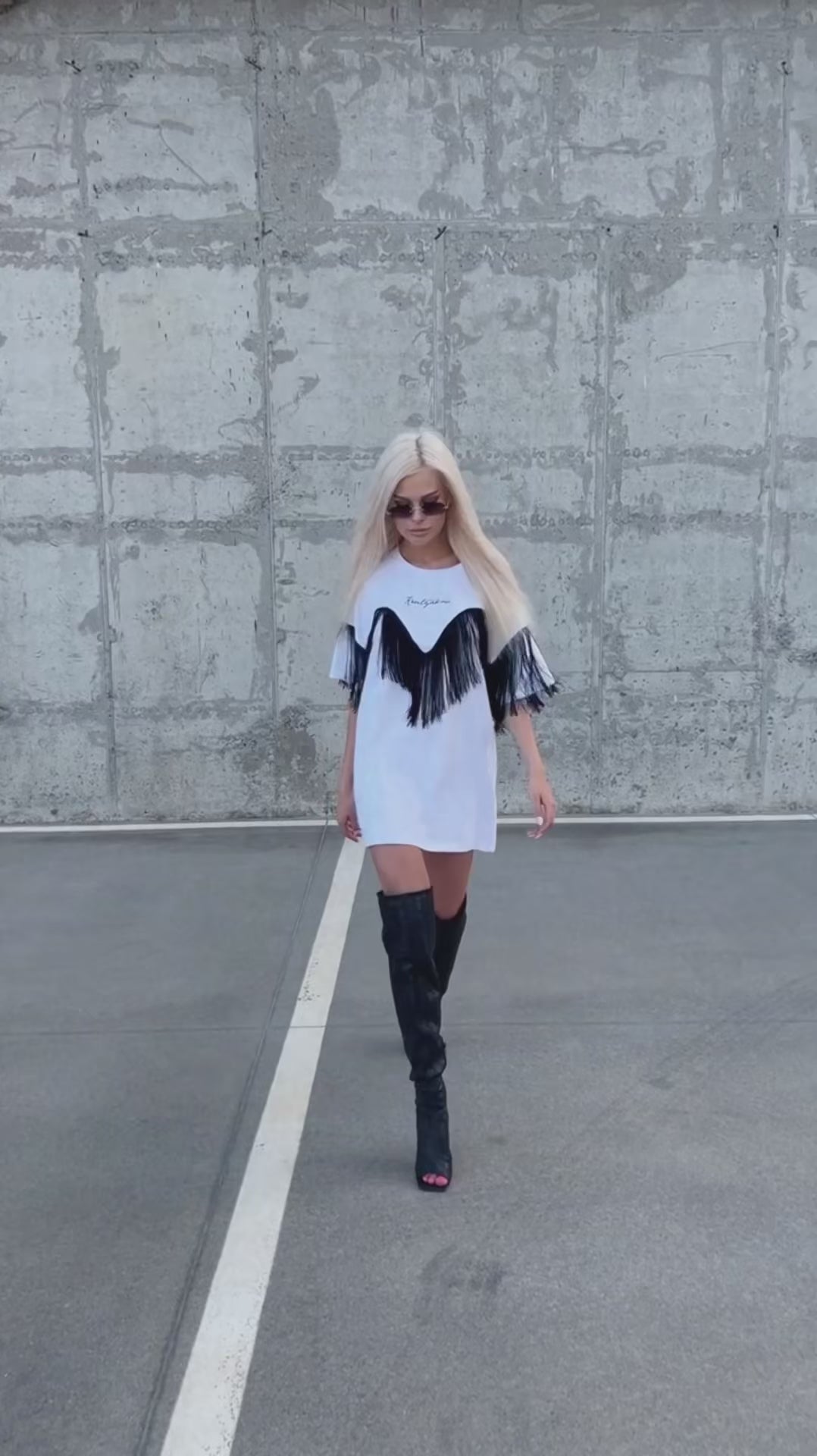 Women’s white oversized T-shirt by KRUTYAKOV featuring statement fringe sleeve detail and modern casual silhouette