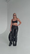 KRUTYAKOV women’s black statement tracksuit set with glossy finish, cropped jacket, and confident urban look