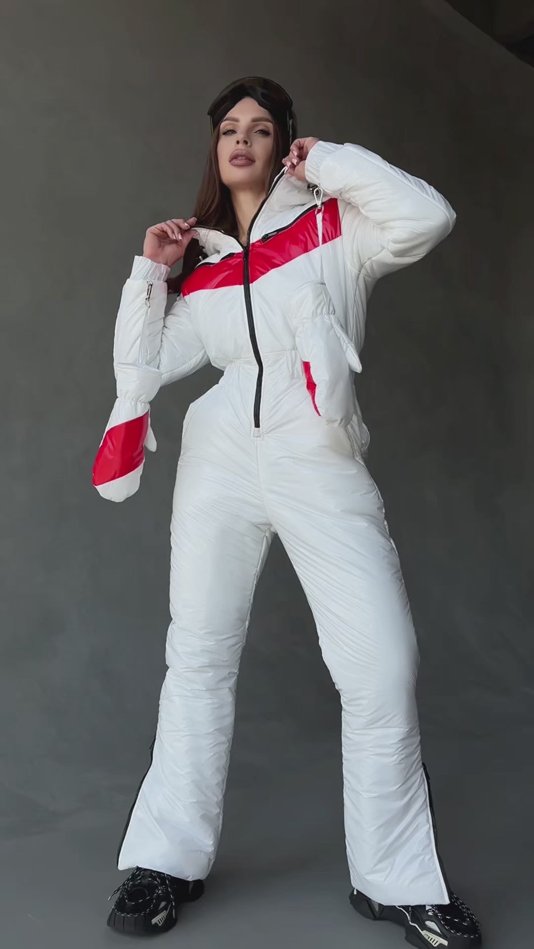 Women wearing KRUTYAKOV SANTA white and red one-piece ski suit