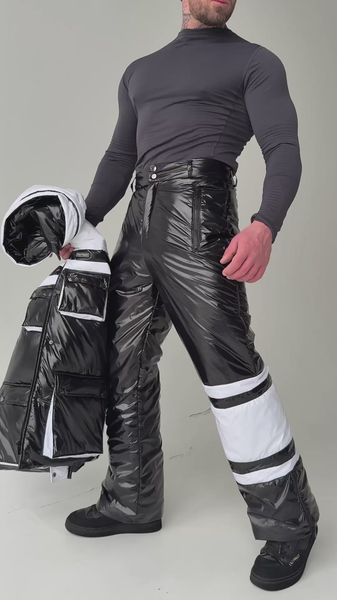 Black men’s two-piece snow suit with insulated jacket and pants